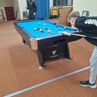 Students enjoying pool at lunchtime