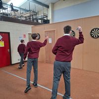 Students playing darts at Grange PPS